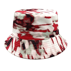 Detailed view of red and black tie-dye bucket hat with reinforced stitching on the brim