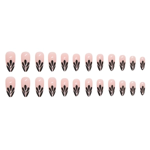 French almond press-on nails with pink base and black petal droplet patterns