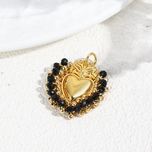 Elegant gold heart pendant with black faceted beads and handmade woven details
