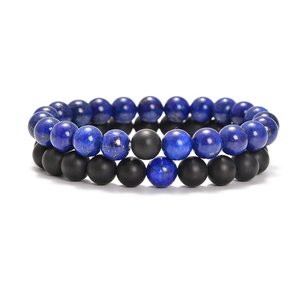 Detail of 8mm natural lapis lazuli and black lava stone beaded stretch bracelets set