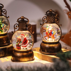 Close-up of vintage bronze Christmas lantern with Santa scene and warm LED lighting