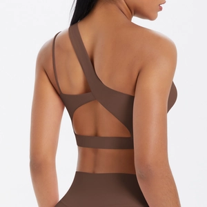 Macro shot of dark brown sports bra featuring asymmetrical one-shoulder and hollow back design