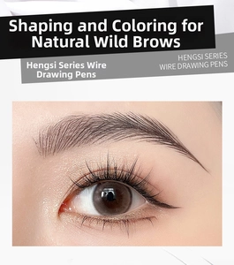 Macro shot of natural eyebrow makeup effect showing fine strokes and thick lashes