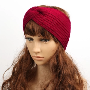Detail of burgundy thick knit headband featuring a stylish front twist knot design