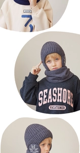Detail view of dark grey thick knitted kid's winter hat with warm fleece neck scarf set