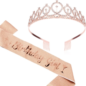 Close-up of rose gold birthday girl sash with glitter fabric and crystal crown tiara