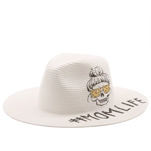 White woven fedora straw hat featuring skull illustration and MOMLIFE text print