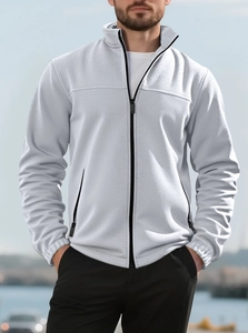 Detail of grey fleece sweatshirt with high collar and full black zipper closure