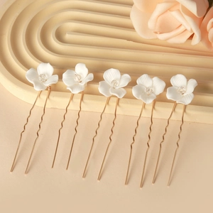 Detailed set of 5 bridal hair pins with white ceramic flowers and crystal centers