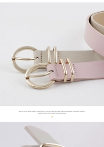 Détail de ceintures en cuir rose et beige avec boucles rondes dorées et coutures précises