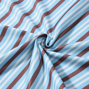 Close-up of sky blue and white striped knit fabric showing fine ribbed texture details