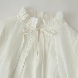 Elegant white pleated ruffle neck dress with bow tie detail for fashion-forward women