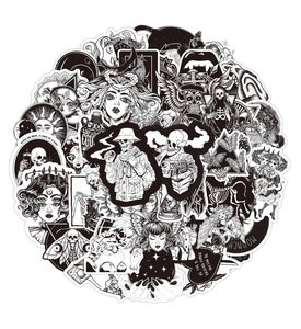 Macro view of black and white gothic punk graffiti stickers with skull and tarot designs