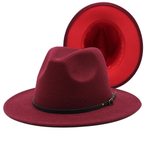 Detail of burgundy fedora with black leather belt and vibrant red interior lining