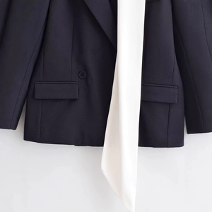 Women's black blazer with white satin scarf trim and minimalist single-breasted design