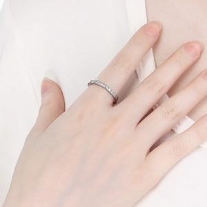 Close-up of minimalist silver stainless steel ring with micro-set rhinestones on hand