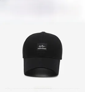 Close-up of a black baseball cap featuring detailed embroidery and narason mountain patch