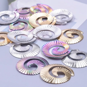 Macro shot of spiral stainless steel jewelry accessories in gold, silver, and rainbow finishes
