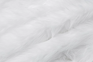 Close-up showing the soft and fluffy texture of the white faux fur dress material