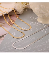 Detailed view of gold and silver snake chain necklaces elegantly placed on a card