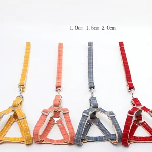 Adjustable plaid dog harness and leash set in blue, pink, yellow, and red colors