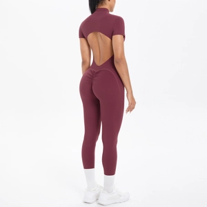 Detail of burgundy backless yoga bodysuit with scrunch butt and cutout design