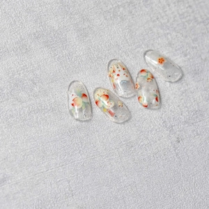 Set of five transparent nail stickers featuring cute rabbit and floral motifs