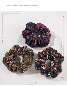 Three-pack Halloween scrunchies featuring skull, pumpkin, and trick or treat patterns