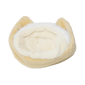Close-up of cat-eared plush pet bed with thick yellow and white faux fur texture
