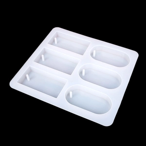 Detail of 6-cavity silicone mold with rectangle and oval slots for DIY resin casting