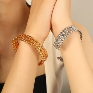 Polished titanium steel open bangles with dot texture in gold and silver finishes