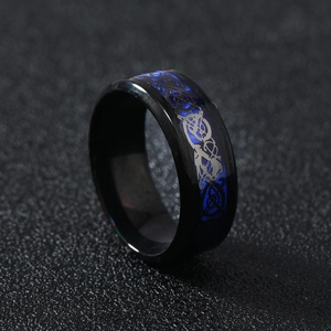 Men's black stainless steel ring with blue Celtic dragon pattern inlay in a flat band style
