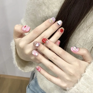 Handmade 3D donut press-on nails with sweet pink heart and strawberry doodle designs
