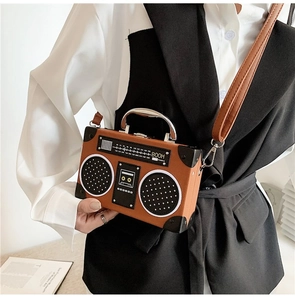 Macro detail of a brown PU leather handbag shaped like a vintage radio with BOOM print