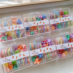 Detail of candy-colored kids hair accessories set with spiral ties and mini clips