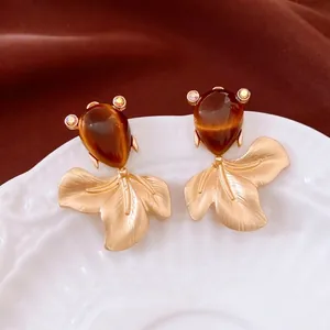 Vintage gold-plated fish drop earrings with amber cat-eye stones and rhinestones