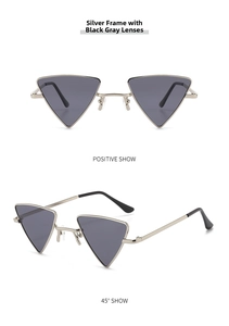Detail view of silver triangle sunglasses with dark grey lenses in front and 45-degree angle