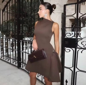 Detail of a brown sleeveless one-shoulder mini dress with metallic accent and matte finish