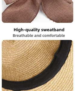 Detailed close-up of premium sweatband and brown bow tie on woven summer straw hat