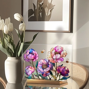 Detailed acrylic flower plaque with bee design on a wood base in a bright room