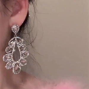 Elegant silver drop earrings with shimmering crystals for a high-end luxury look