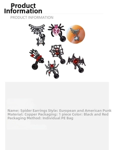 Close-up of spider ear studs with red cubic zirconia in Gothic punk jewelry style