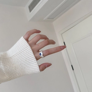 Minimalist S925 sterling silver irregular ring with blue and white gemstones on hand