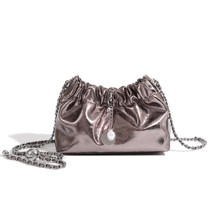 Silver metallic dumpling bag with soft pleats, pearl chain strap and drawstring closure
