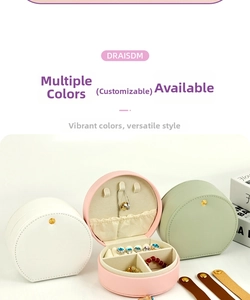 Three elegant round PU leather jewelry boxes in white, pink, and green showing storage details