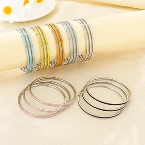Colorful stackable 3mm stainless steel round bangles with vibrant enamel dripping oil finish