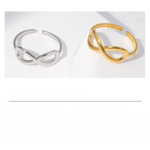 Macro detail of infinity symbol stainless steel open ring with size and weight specs