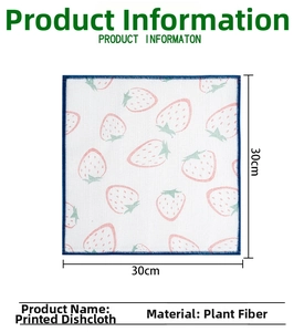 Detail view of 30x30cm plant fiber dishcloth with strawberry print and blue stitched edges