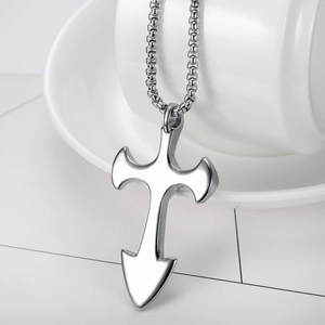 Polished silver stainless steel cross pendant necklace with arrowhead base on a chain
