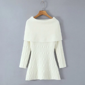 Detailed cable-knit texture of a white off-shoulder long sleeve sweater dress on hanger